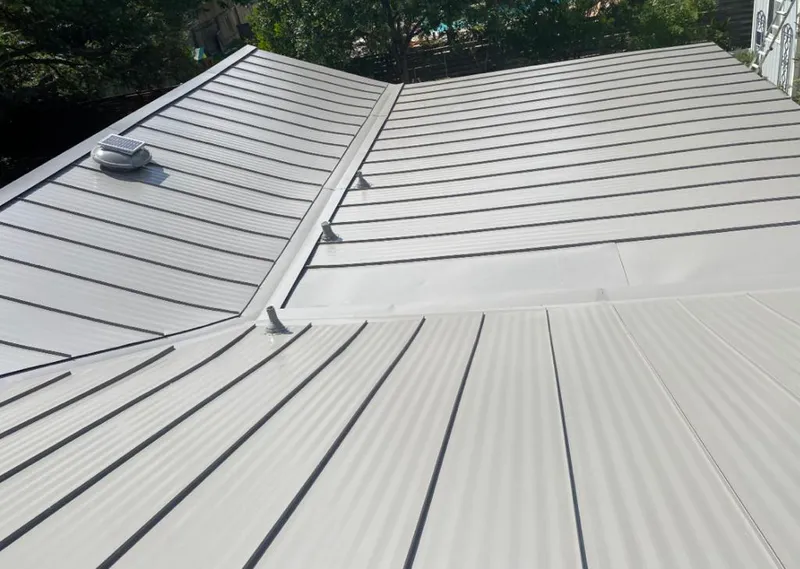 Solar attic fan installed on a metal roof for Roof Ventilation in Elkridge